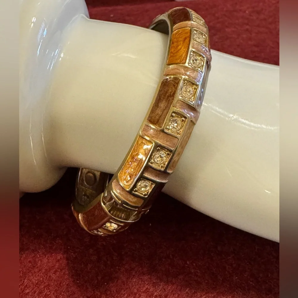Gold tone with brown and caramel enamel hinged bracelet w/rhinestone accents